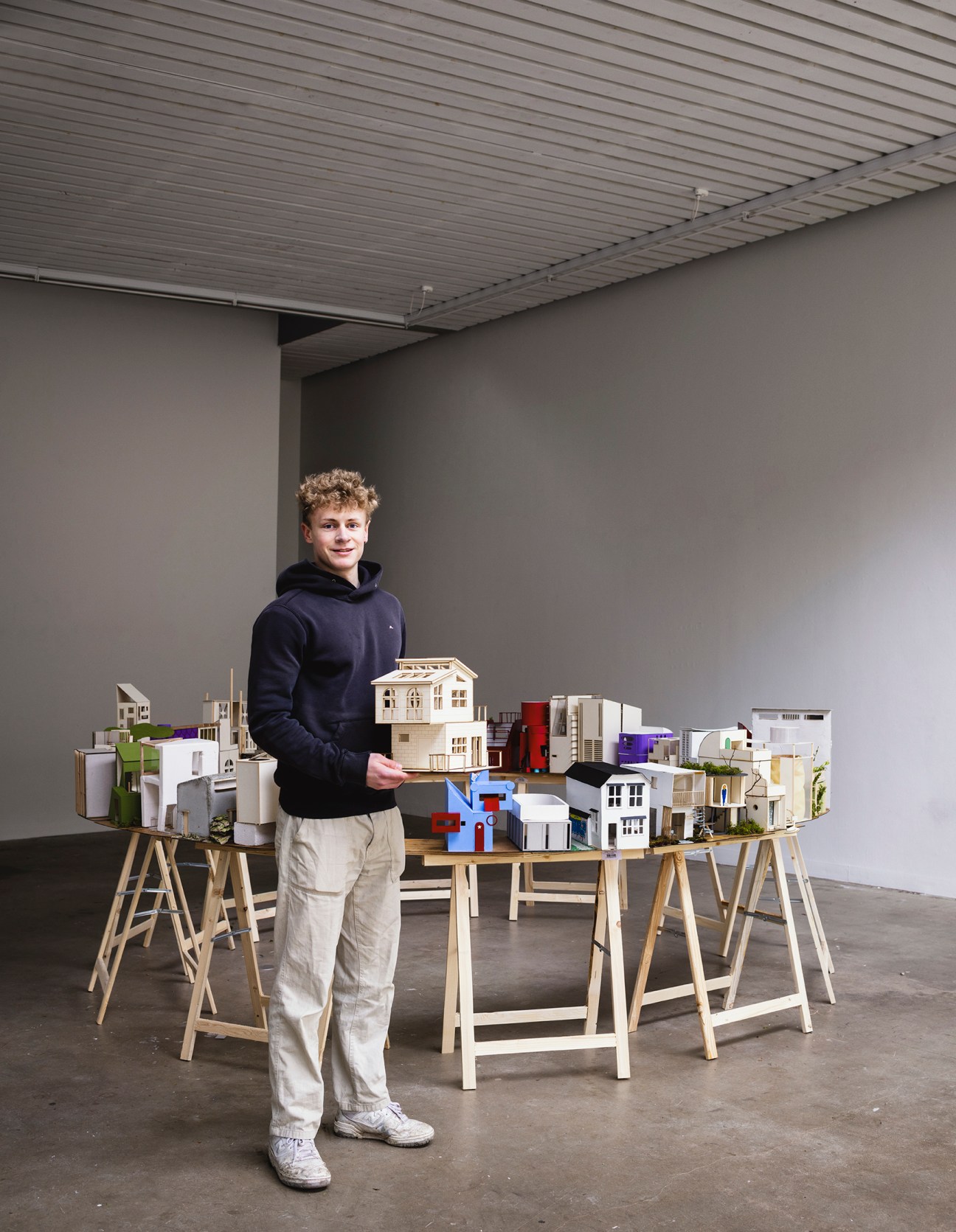 student with a paper model