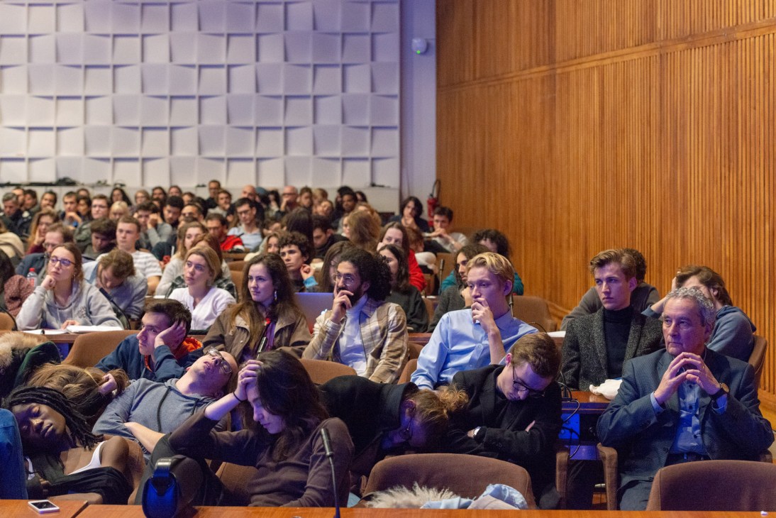 Audience members seated in a lecture hall at Unesco headquarters during an all-night philosophy marathon event.
