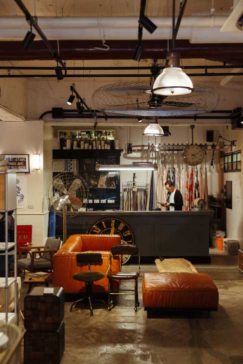 Complex Universal Furniture Supply showroom with modern furniture displays and industrial ceiling.