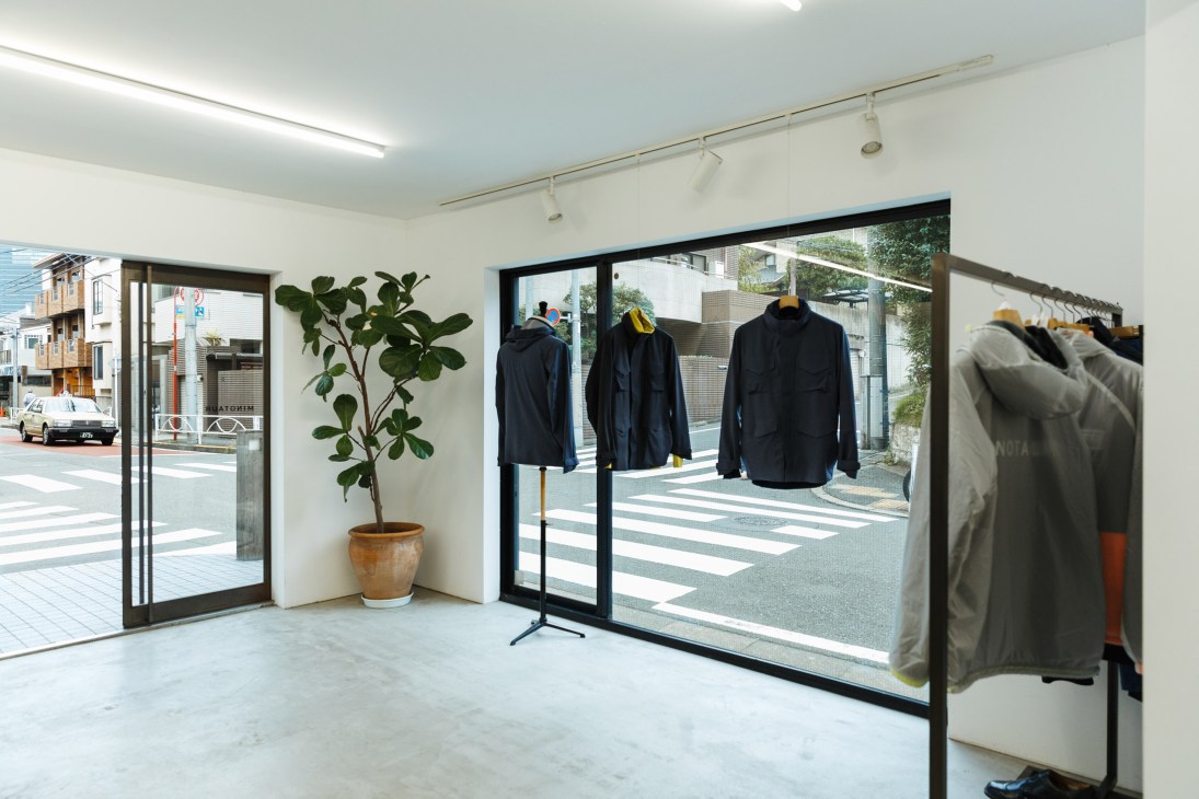 Minotaur menswear store interior showing clothing displays and minimalist white walls