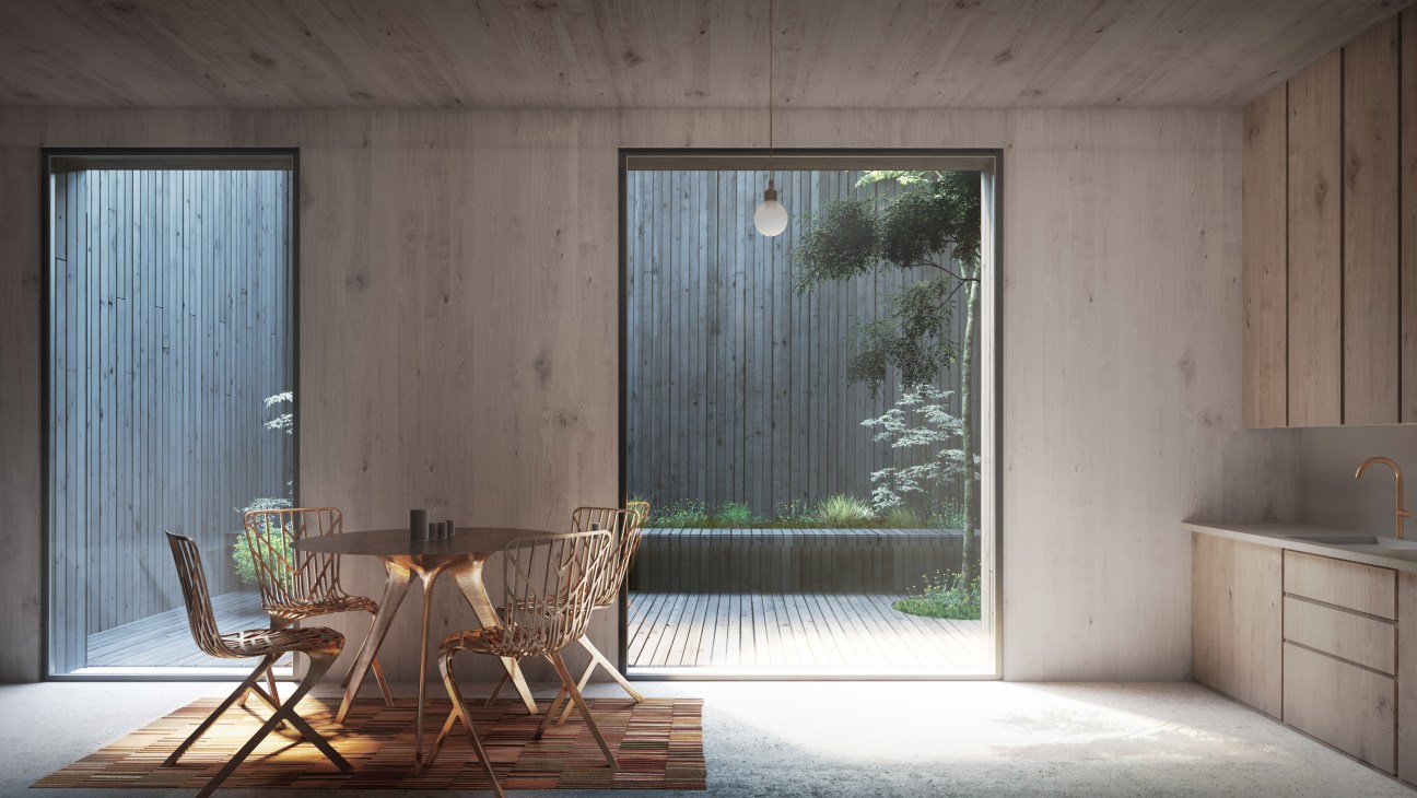 Modern interior with concrete walls, wooden dining table, chairs, and large windows opening to courtyard garden.