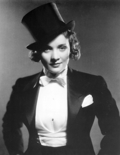 Black and white portrait of Marlene Dietrich wearing a tailcoat and top hat