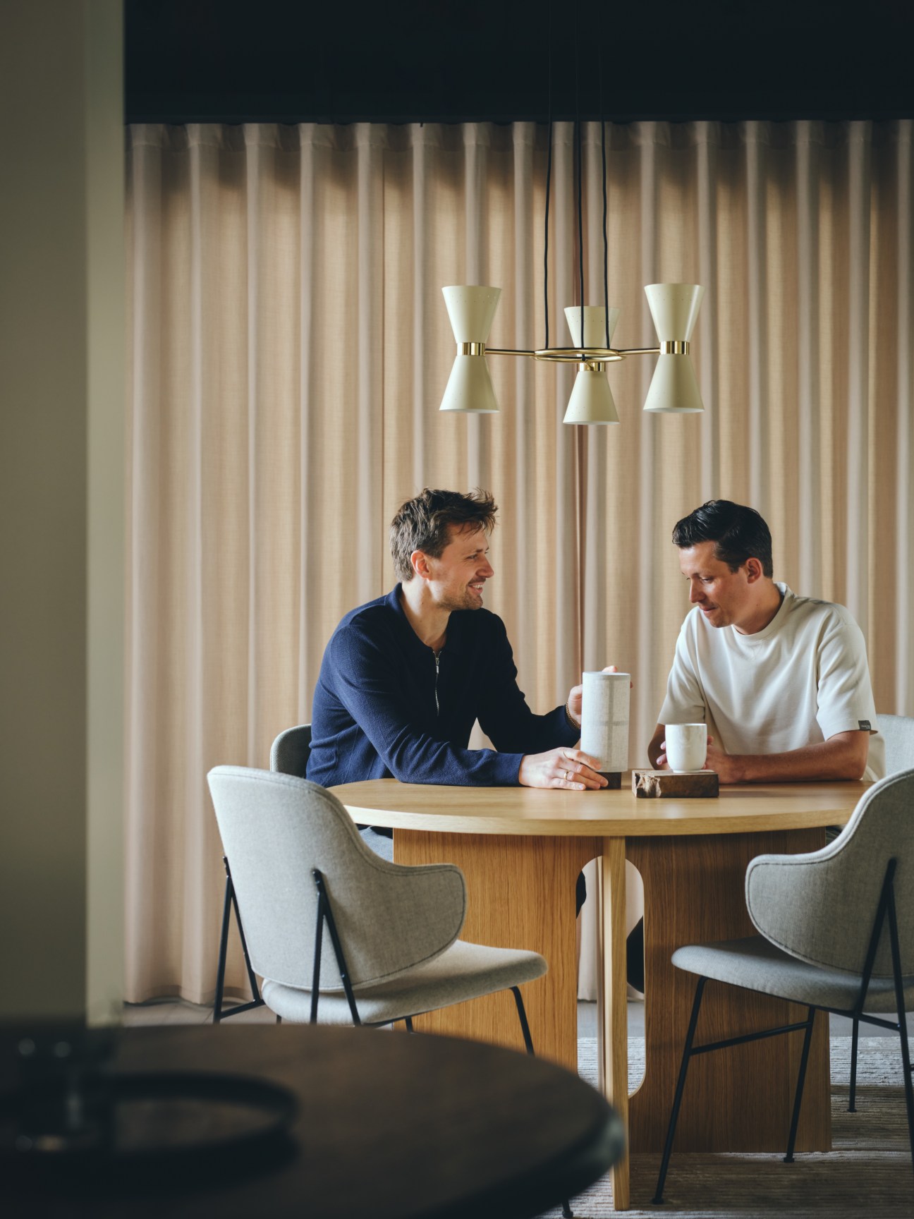 Norm Architects chatting and having coffee