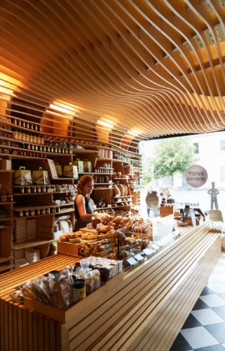 Baker Daniel Chirico working in his Melbourne bakery with fresh bread and pastries