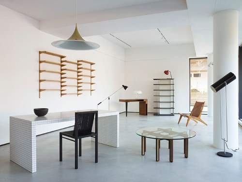 Interior of Béton Brut furniture showroom with mid-century modern pieces and minimalist décor.
