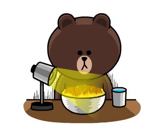 Brown, a cartoon bear character wearing a yellow shirt, holding cooking utensils in a kitchen setting.