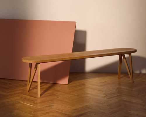 Wooden bench with angular lozenge-shaped design and three-legged base by JL8 Faber from Loehr.