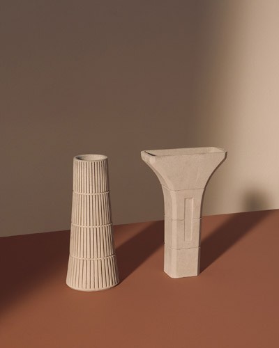 Two concrete vessels from Tiipoi's Siment Collection with geometric forms inspired by Indian metro pillars.