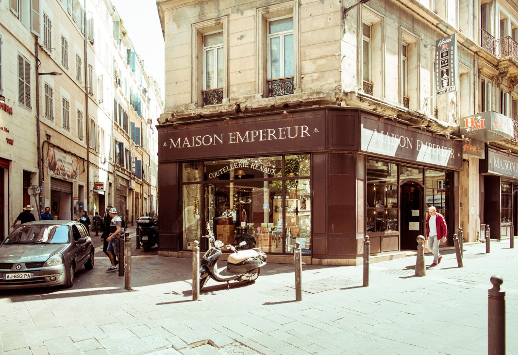 Maison Empereur's storefront on Rue des Récolettes in Marseille with brown awning and display windows.