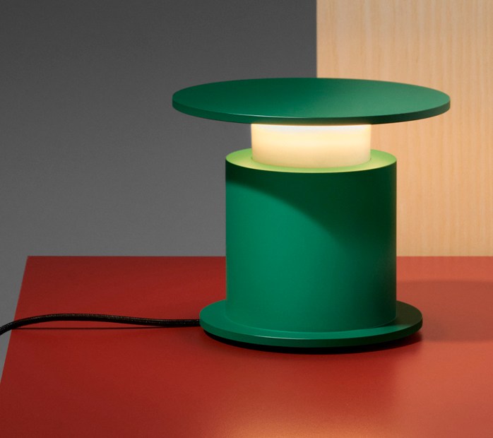 Green W241 Faro lamp on red surface