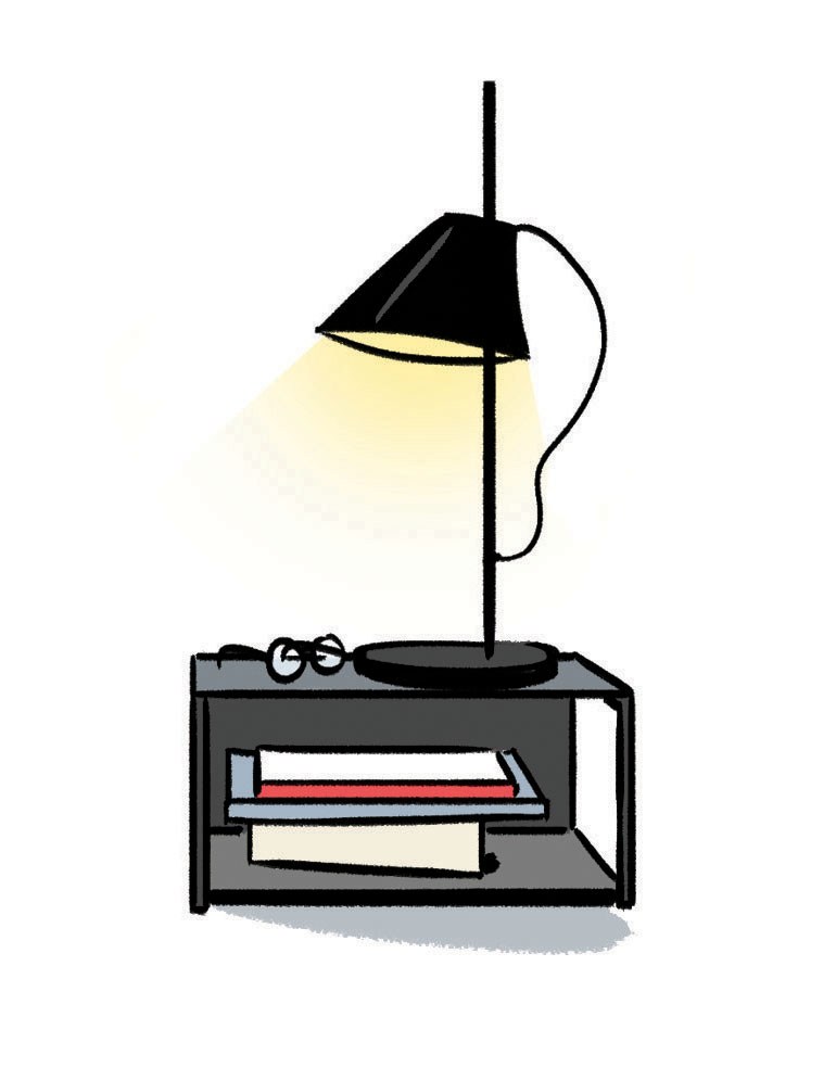Illustration of Yuh lamp by Louis Poulsen with black shade emitting warm light above a dark table with books.