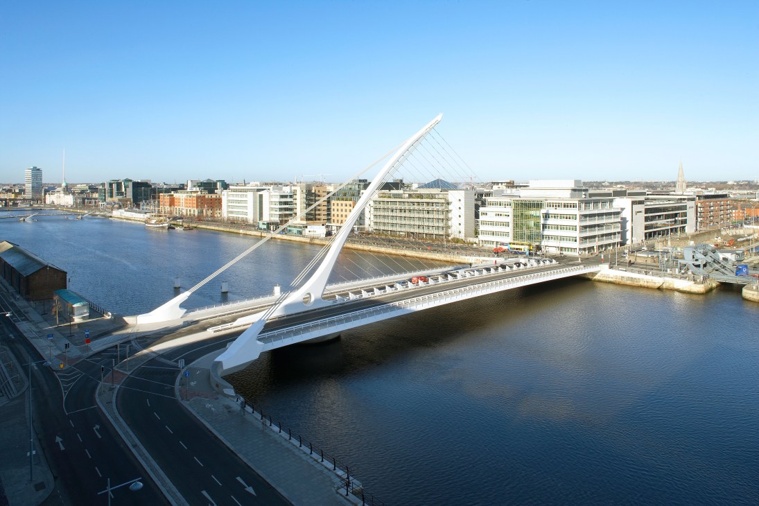 Santiago Calatrava's Samuel Beckett Bridge spanning the River Liffey in Dublin with white cable-stayed design.