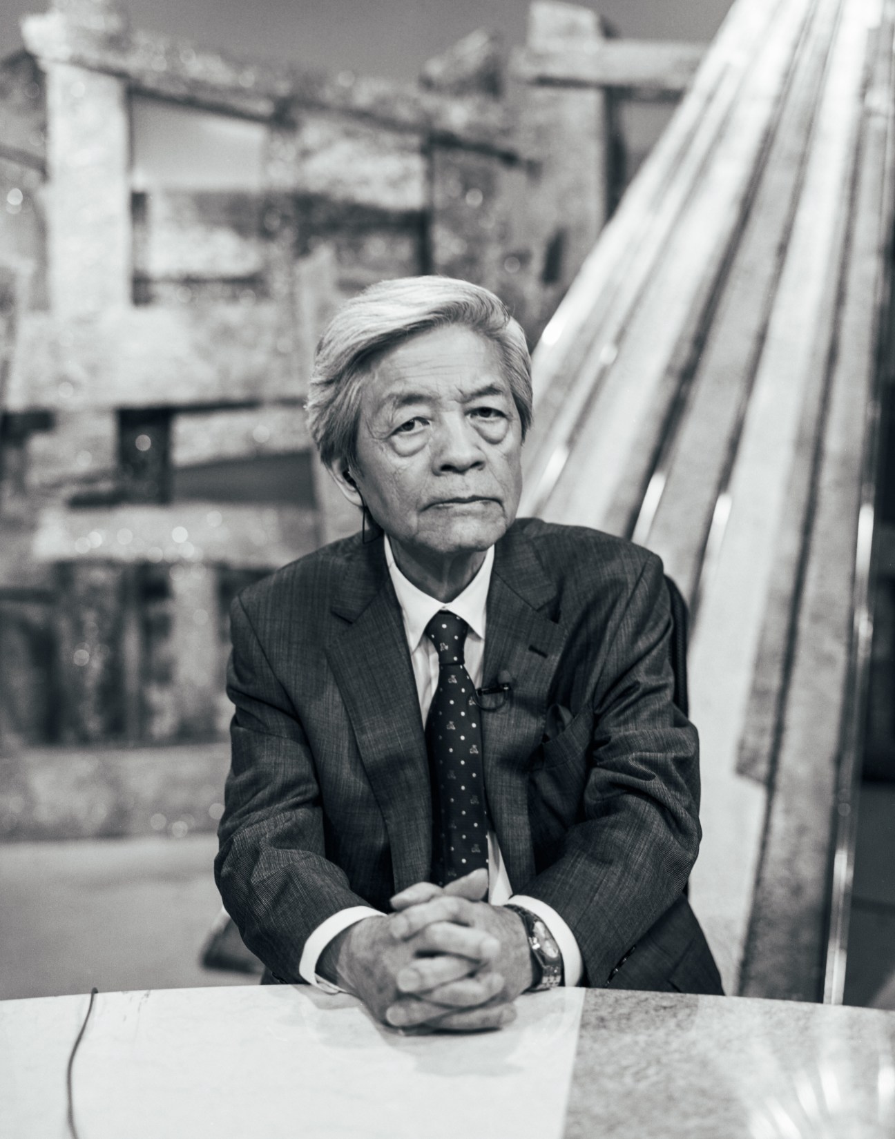 Soichiro Tahara, veteran Japanese television presenter, sitting at a desk in professional attire