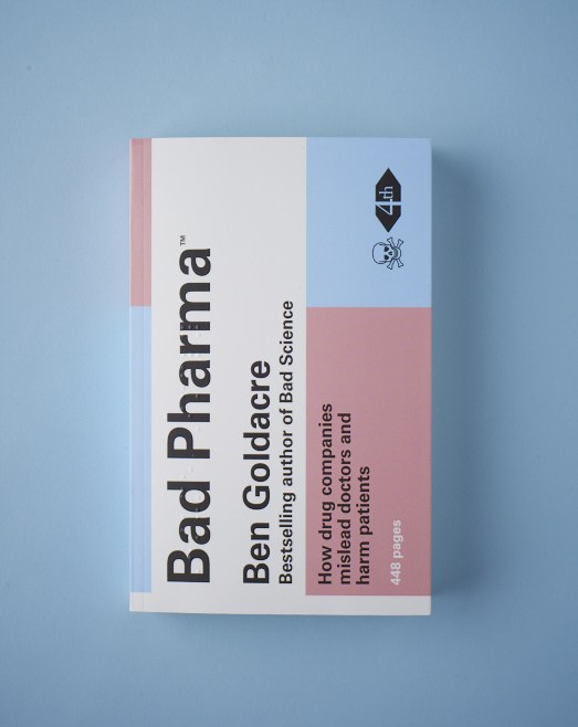 Book cover of 'Bad Pharma' by Ben Goldacre featuring pink and blue sections on a light blue background.