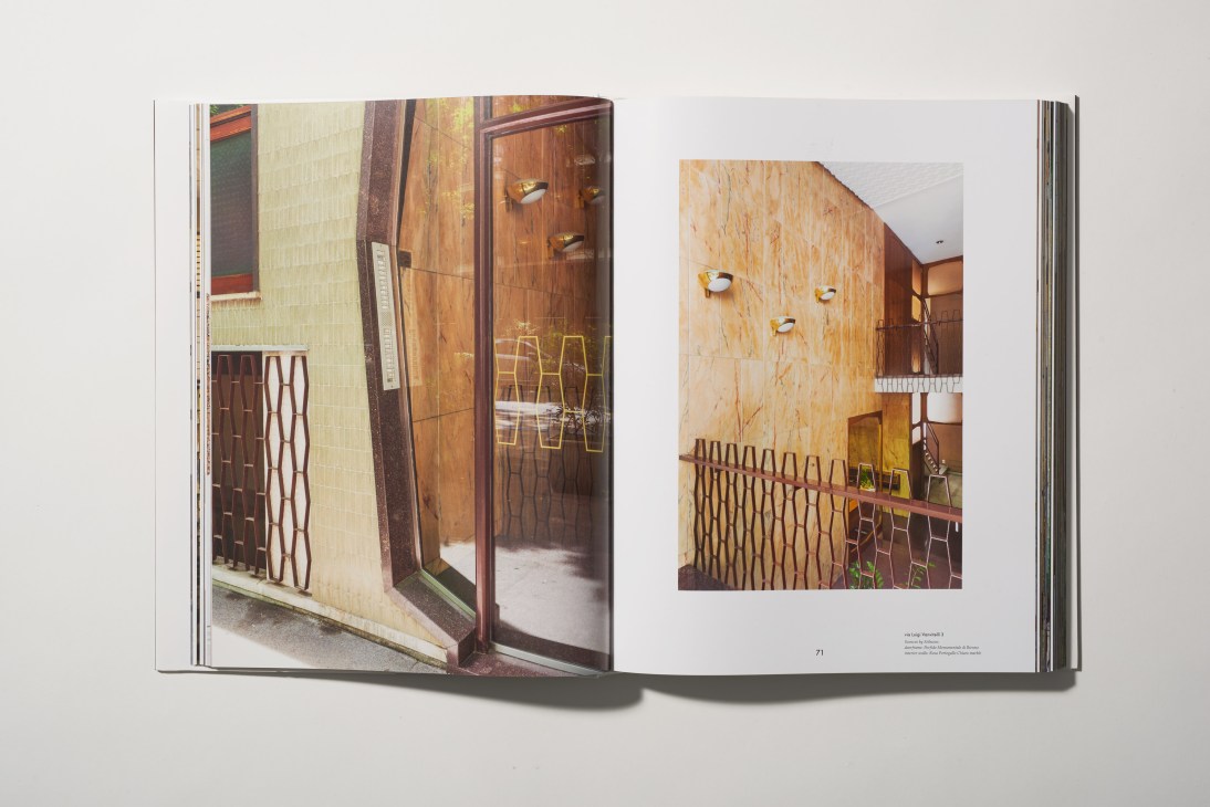Open book showing photographs of ornate Milan residential doorways and entryways with detailed architectural features.