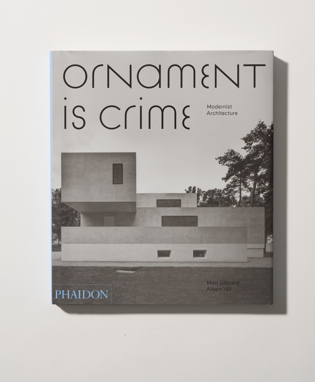 Book cover of 'Ornament is Crime: Modernist Architecture' by Matt Gibberd and Albert Hill, published by Phaidon, featuring a modernist concrete building.