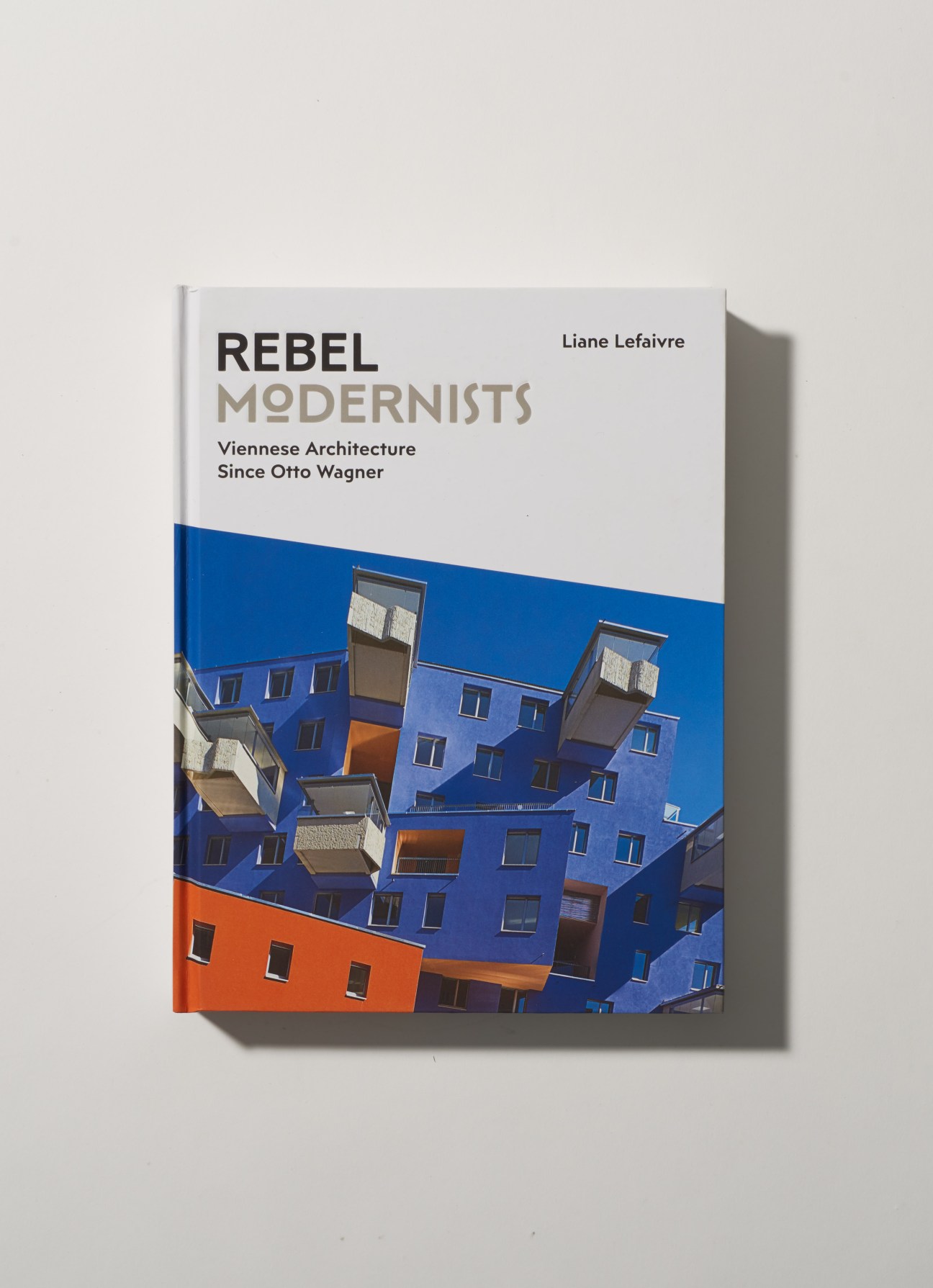 Book cover of 'Rebel Modernists: Viennese Architecture Since Otto Wagner' by Liane Lefaivre featuring a colorful modern building facade.