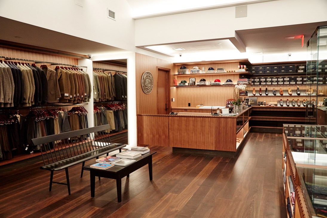 Interior of J Press tailor shop on Madison Avenue featuring Kaneka OLED lighting system creating warm, natural glow.