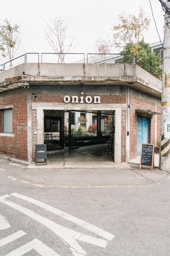 Industrial interior of Café Onion in Seoul showing rustic design and bakery space