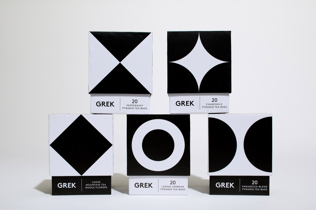 Five Grek herbal tea boxes with black and white geometric designs displayed against light background.