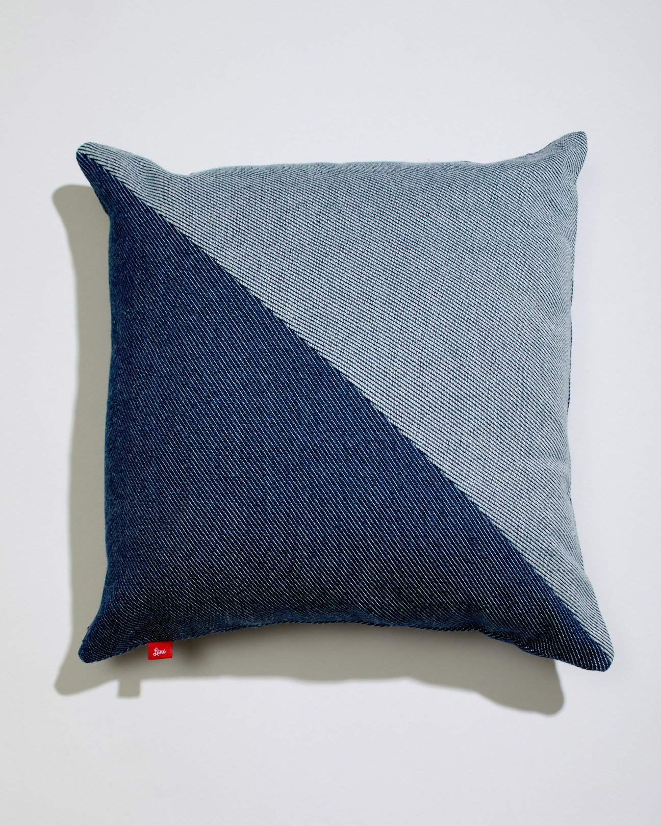Blue striped indigo and white cushion by Lane x London Cloth with ribbed texture.