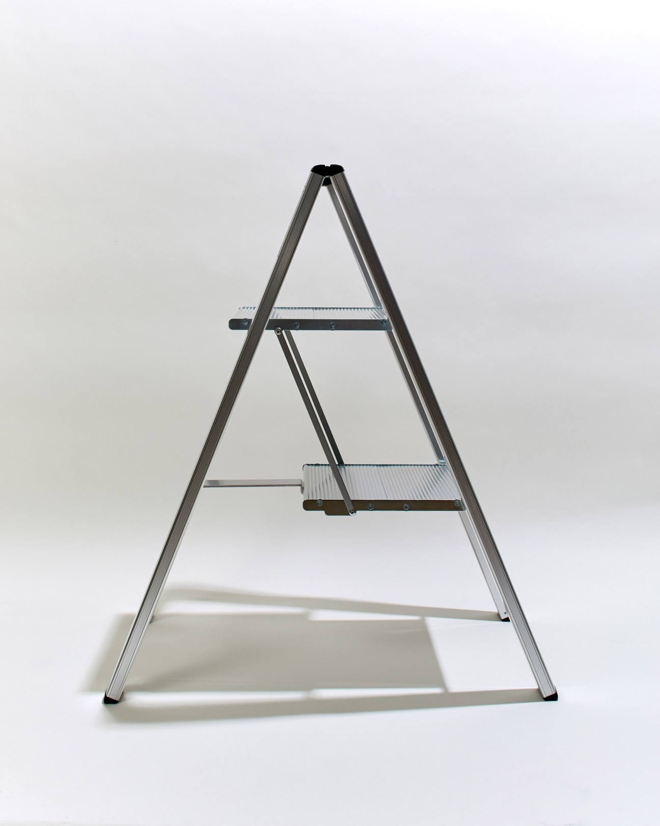 Hasegawa stepladder in silver with two steps against white background.