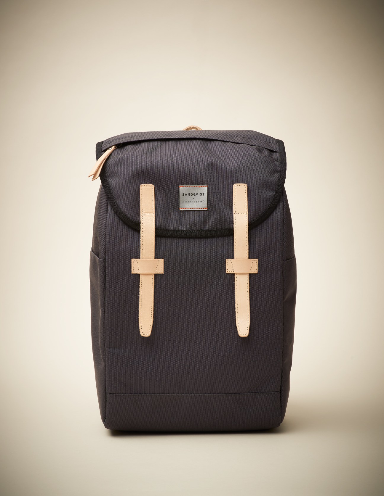Hasselblad X Sandqvist backpack in black with tan leather straps and branded label