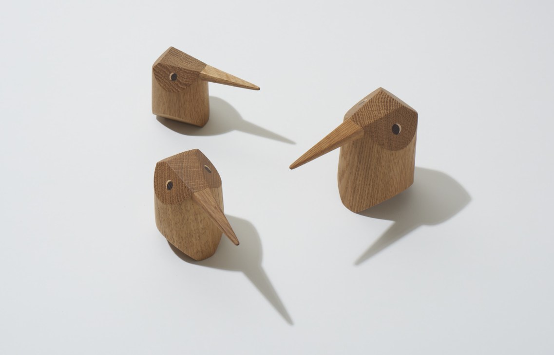 Three wooden bird sculptures by Nuse Design carved from oak, ash and walnut wood.
