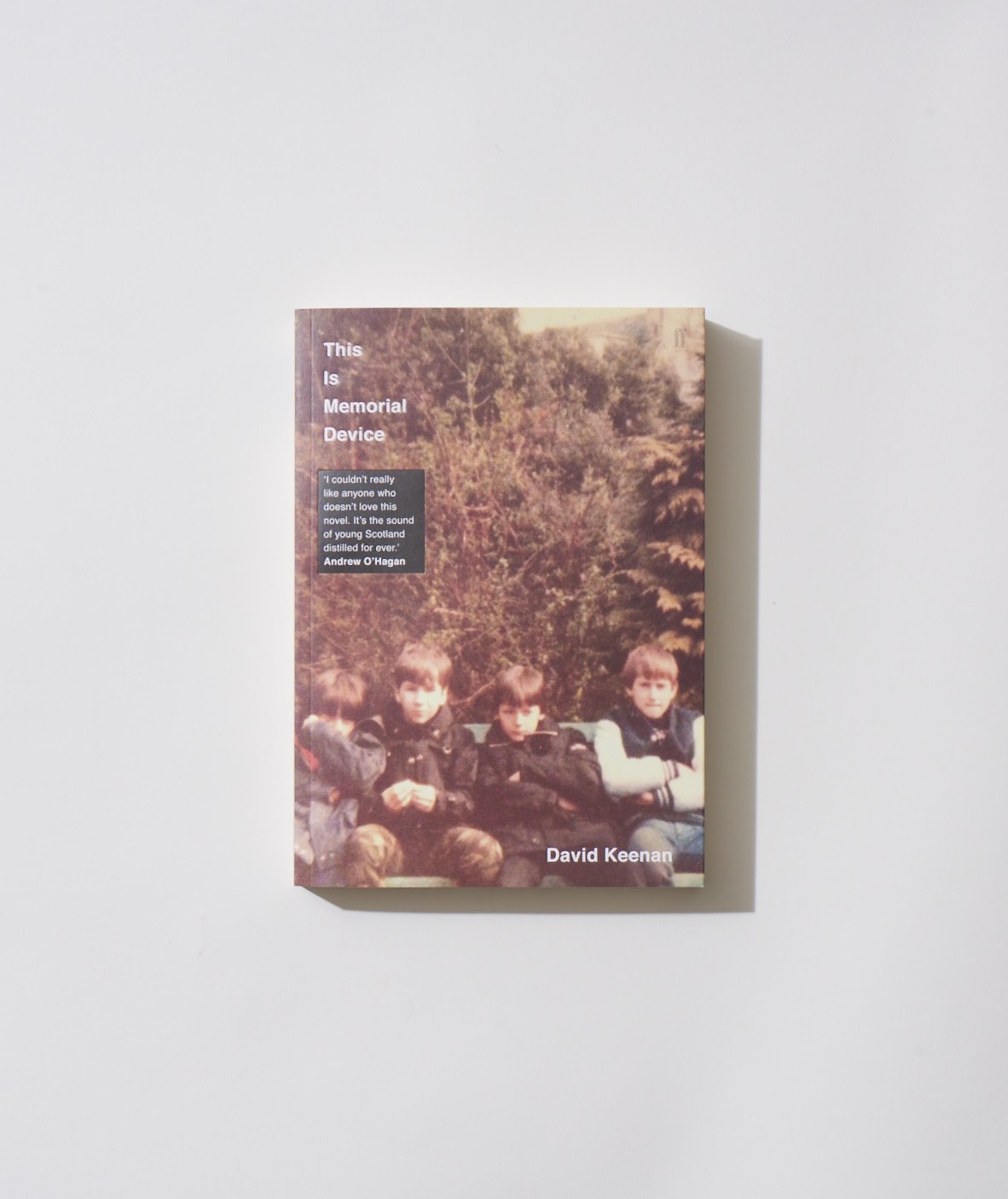 Book cover of This Is Memorial Device by David Keenan featuring children and forest background