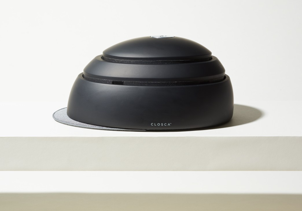 Closca Fuga collapsible bike helmet in black, shown in compact folded state.