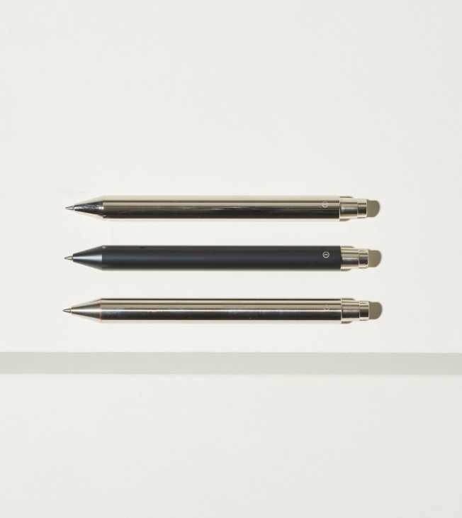 Three mechanical pens in different finishes arranged horizontally against a light background.