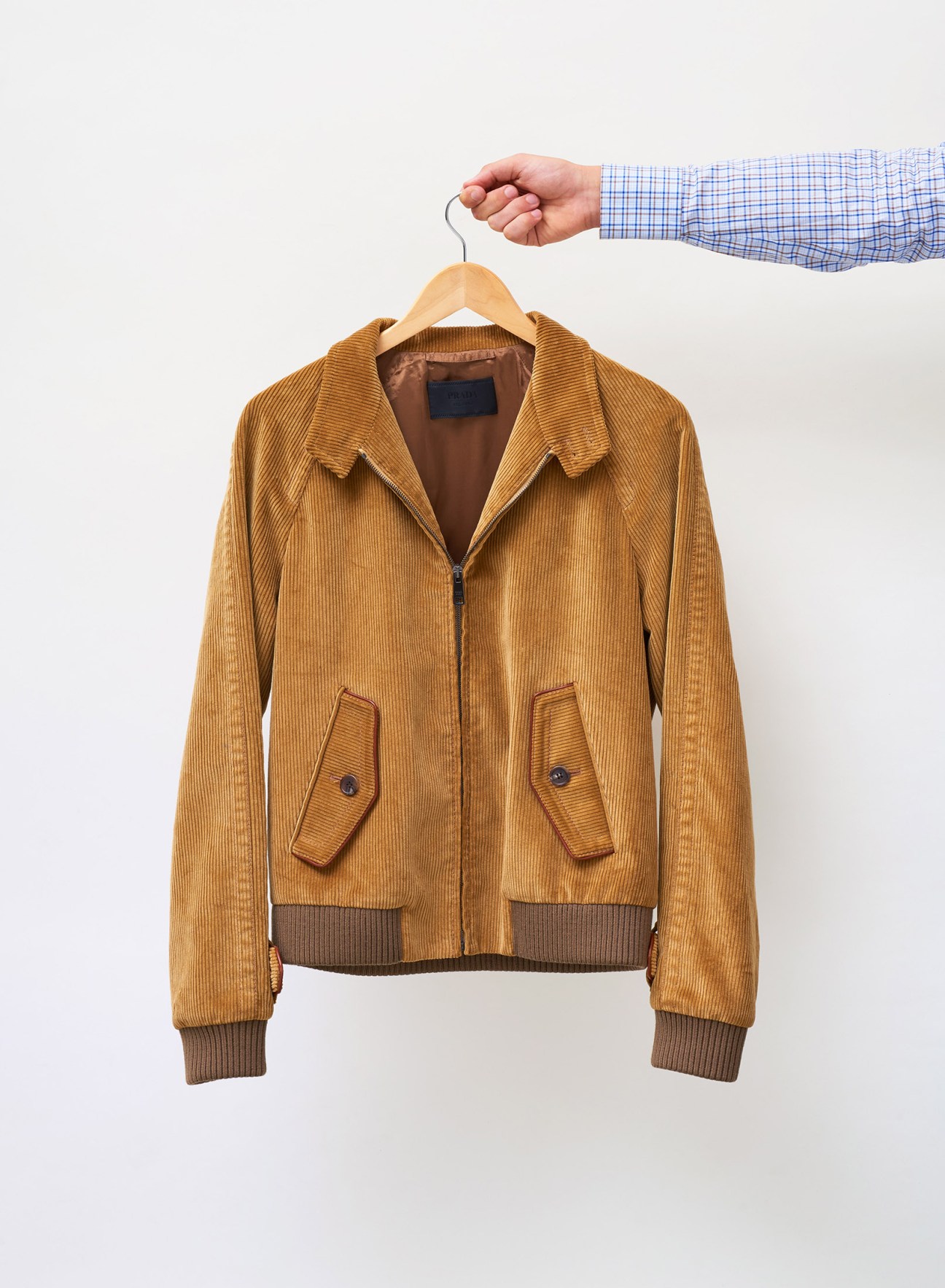 Caramel-coloured corduroy bomber jacket with leather trim and ribbed cuffs by Prada.
