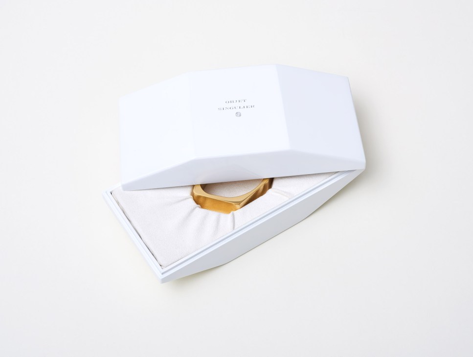 White gift box containing Objet Singulier wooden jewelry packaging with gold-trimmed cuff visible inside