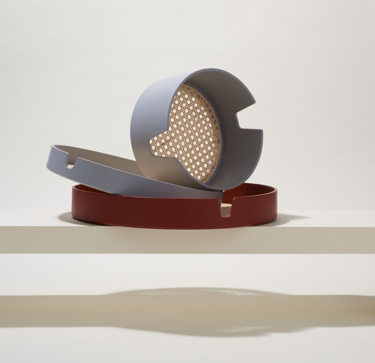 Black and terracotta wicker Salon trays by Normann Copenhagen in various sizes.
