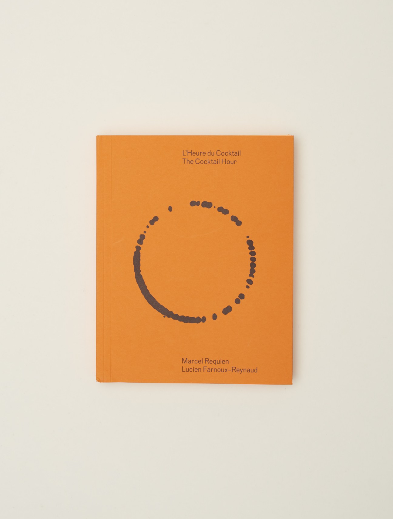 The Cocktail Hour book cover with orange background and circular cocktail glass illustration.