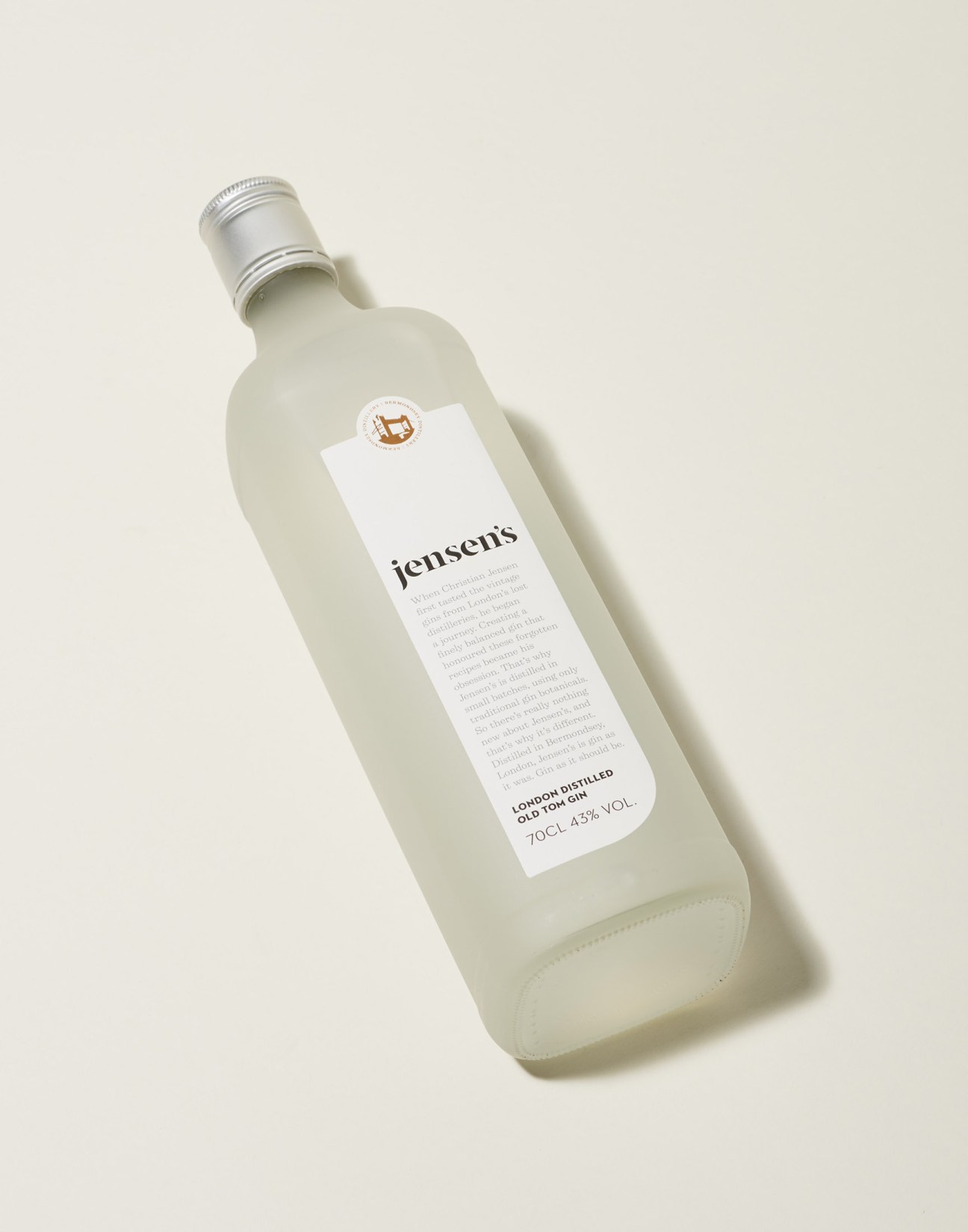 Jensen's Bermondsey gin bottle with white label on cream background