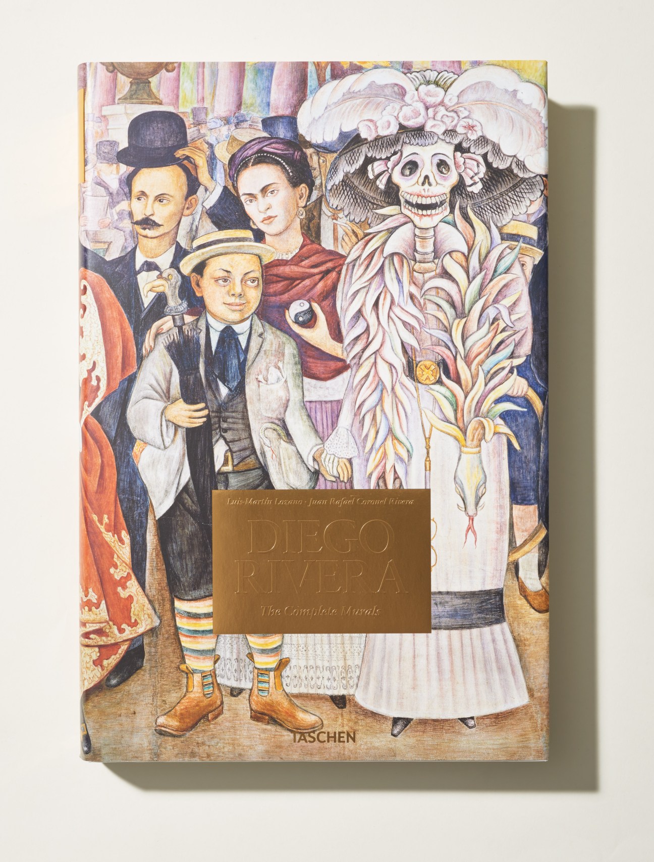 Book cover of Diego Rivera's The Complete Murals featuring colorful mural illustration with figures and skeleton character.