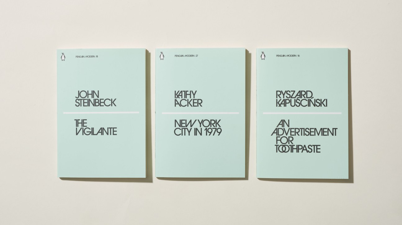 Three light blue Penguin Classics paperback books displayed side by side showing titles by Steinbeck, Acker, and Kapuscinski.