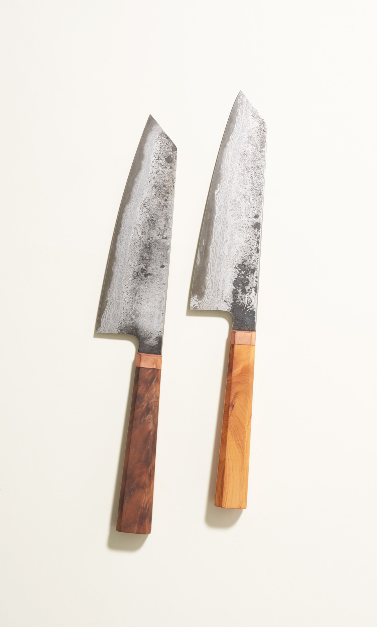 Two chef's knives with Japanese steel blades and walnut or yew wood handles by Blenheim Forge.