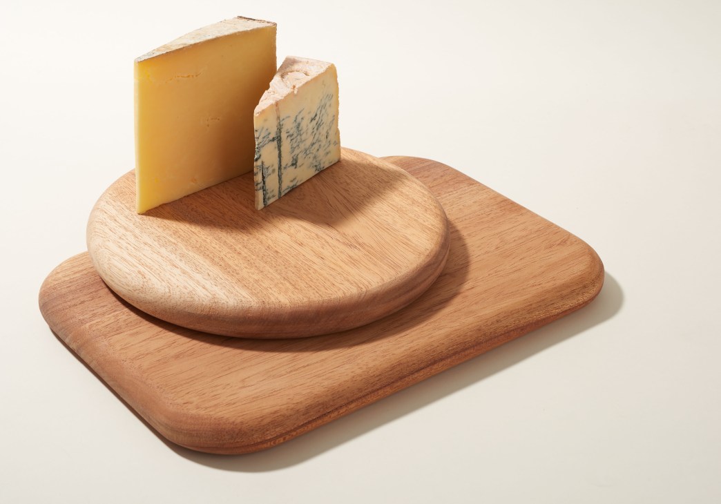 Rocksalt Living wooden chopping boards with cheese displayed on circular and rectangular forms.