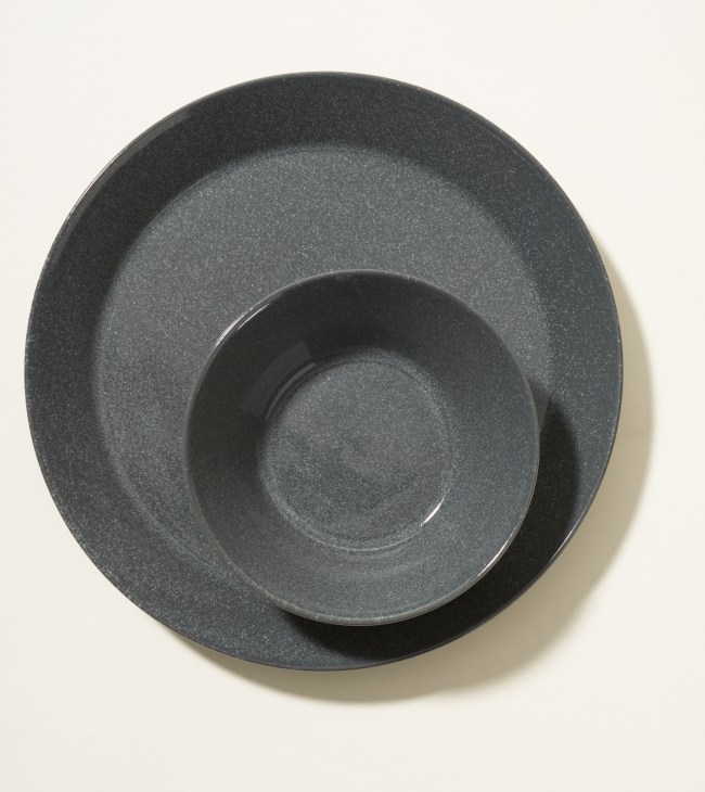 Stacked grey textured ceramic plates from Iittala's Teema collection by Kaj Franck.
