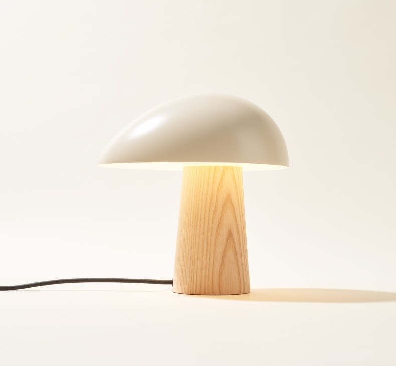 Fritz Hansen Night Owl table lamp with conical ash-wood base and white oval shade.