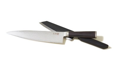 Two handcrafted kitchen knives with wooden handles displayed on white background
