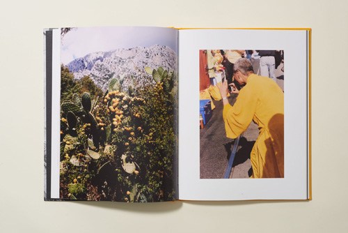 Open magazine spread showing landscape photography on left page and portrait photo on right page with gold-trimmed binding.