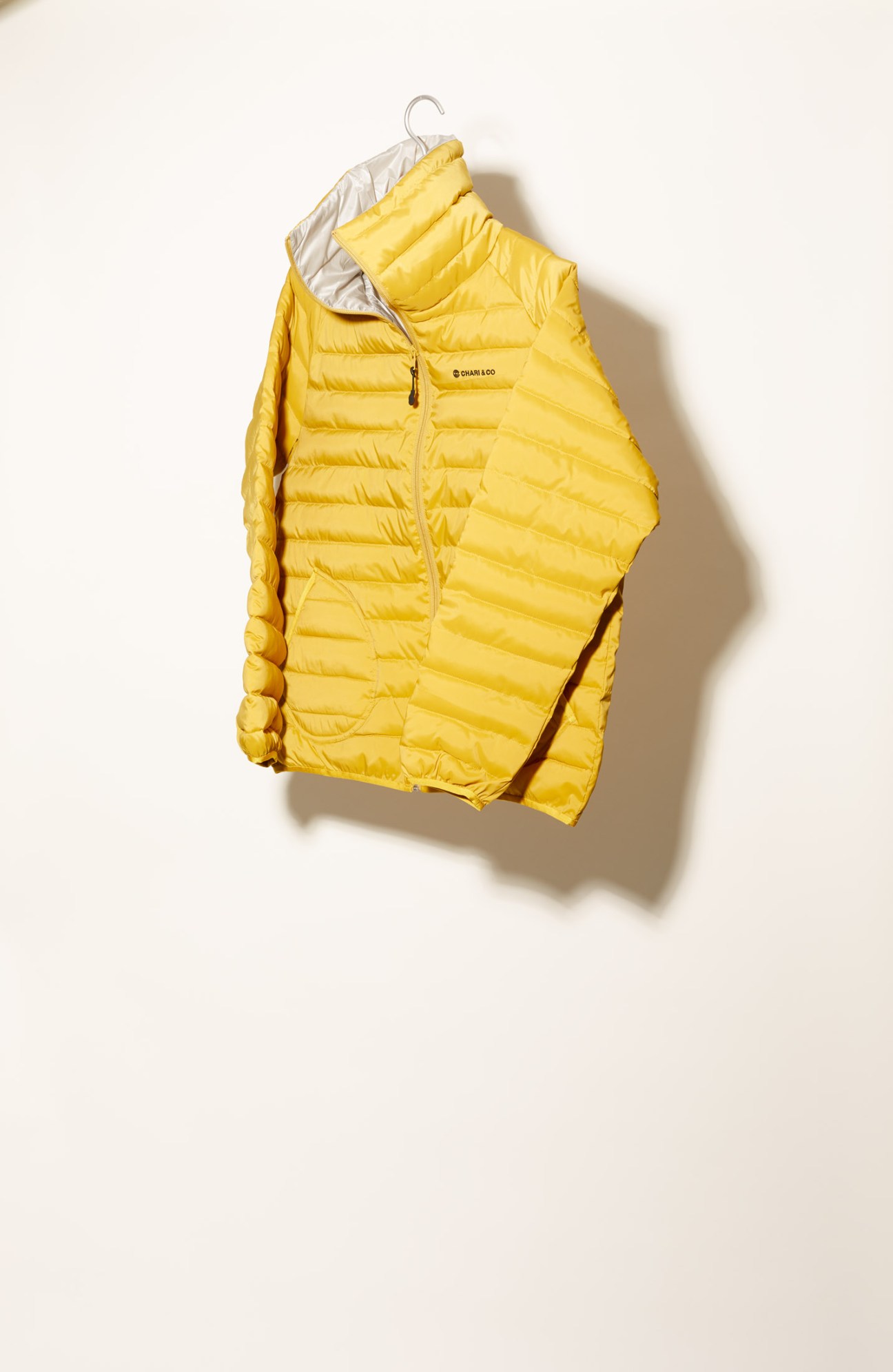 Chari&Co yellow puffer jacket with hood on hanger