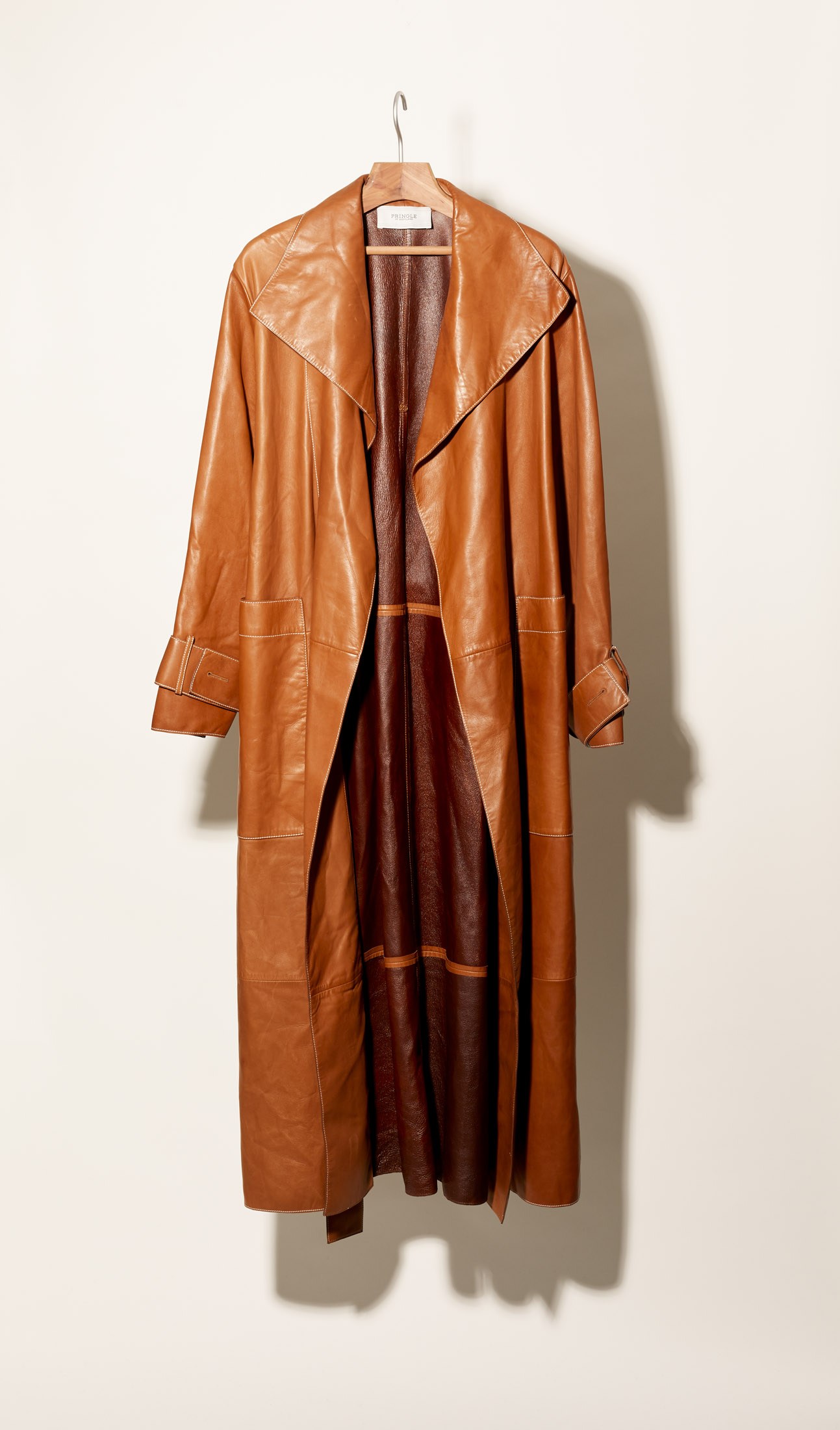 Pringle of Scotland black leather coat displayed on a hanger