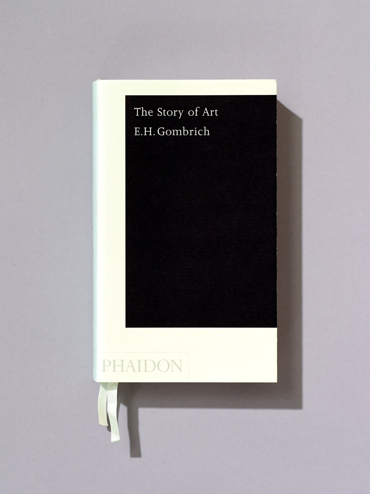 Sonya Dyakova's minimalist book cover design for 'The Story of Art' by E.H. Gombrich, featuring a cream spine with black rectangular panel and white text.