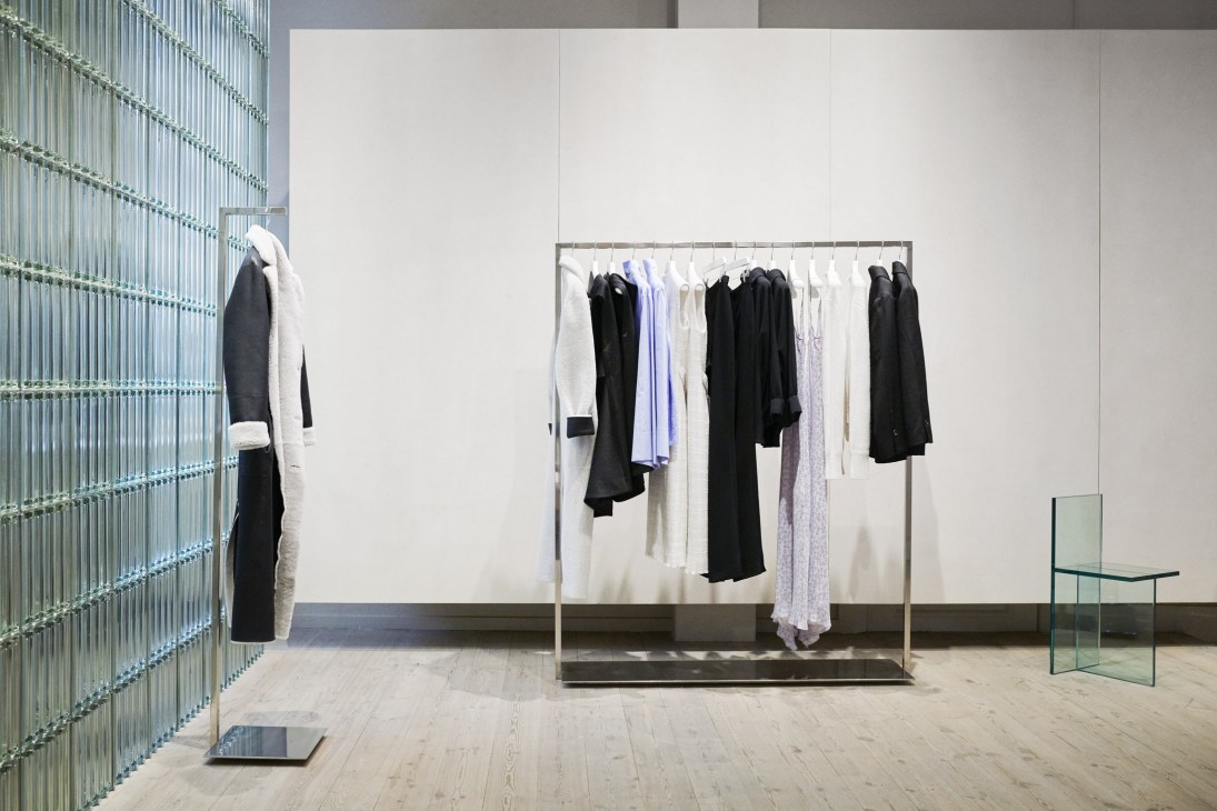 Mark Kenly Domino Tan boutique interior showing clothing displays and modern design