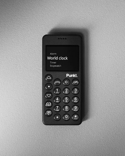 Punkt MP02 mobile phone in black with numeric keypad and minimalist display, designed by Jasper Morrison.