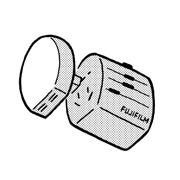 Illustration of Fujifilm World Trip adaptor with USB charging slots and compact design.